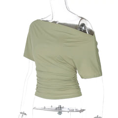 Green off-shoulder top on a mannequin with a white background