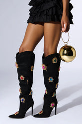 Black embroidered knee-high boots with high heels