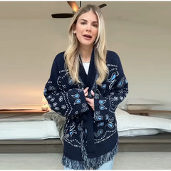 Woman wearing a navy blue patterned scarf indoors