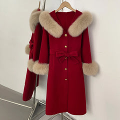 Red wool coat with fox fur collar and cuffs, belted.