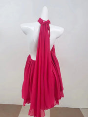 Rose red halter dress on a mannequin against a white background