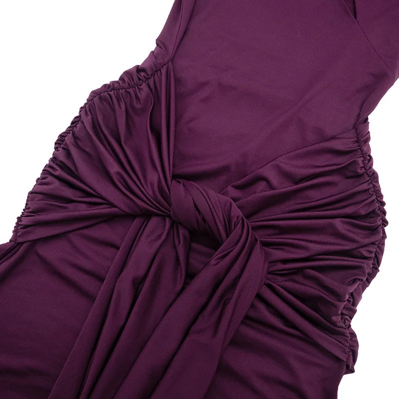 Close-up of a purple dress with a knot detail