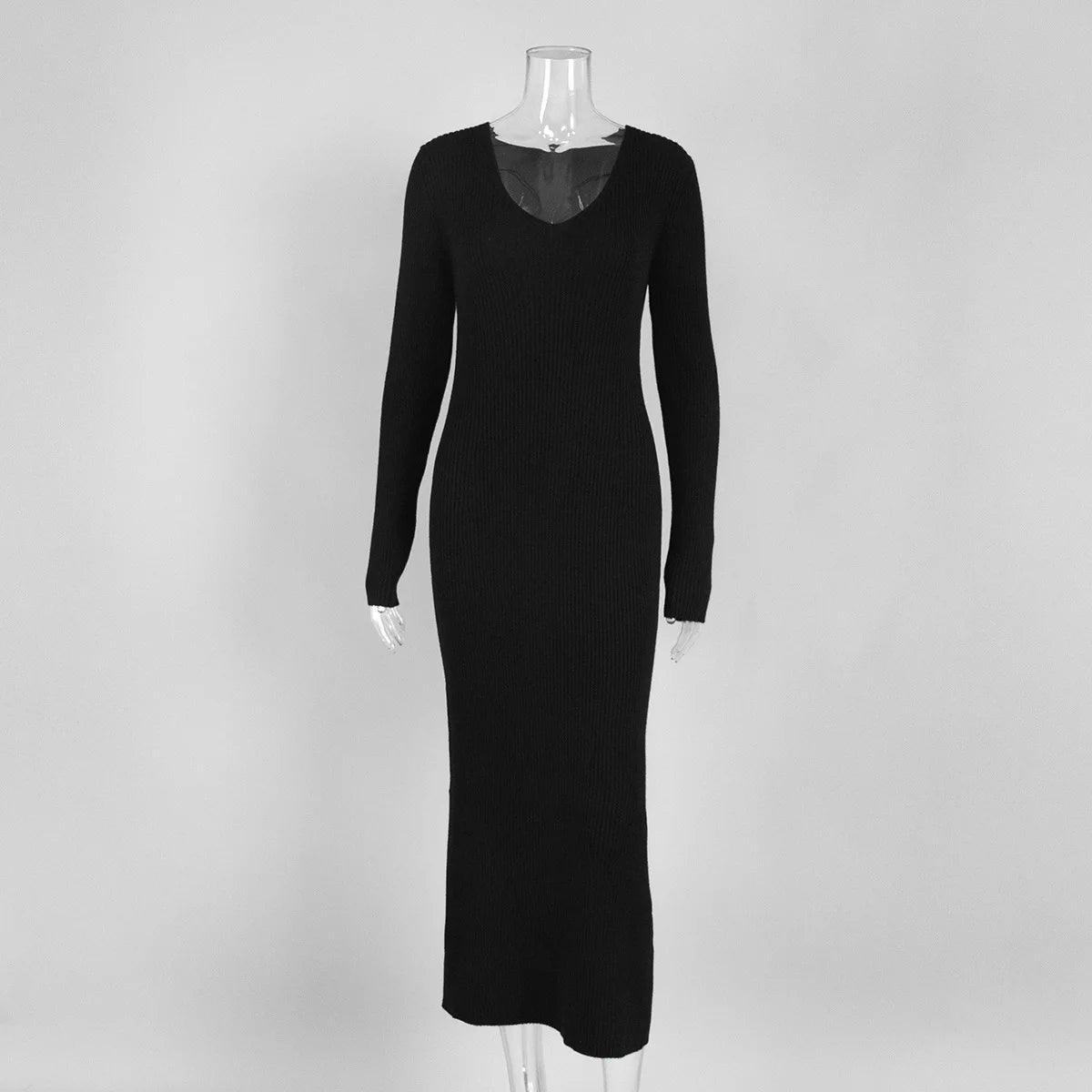 Black dress on a mannequin against a white background