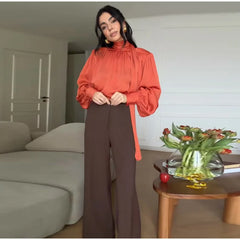 Standneck long sleeve blouse with fold ribbon and button cuffs