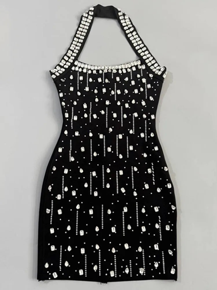 Close-up of black embellished halter neck mini dress
