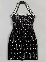 Close-up of black embellished halter neck mini dress