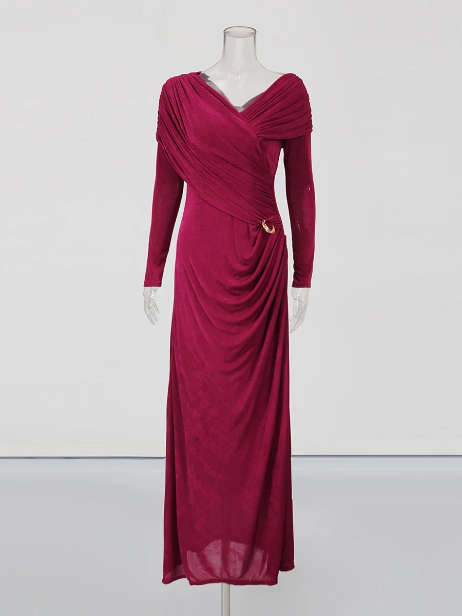 Magenta evening gown on a mannequin against a white background