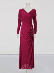 Magenta evening gown on a mannequin against a white background