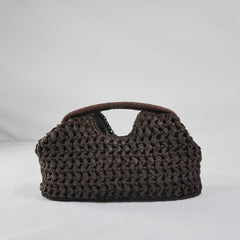 Brown woven handbag on a light gray background