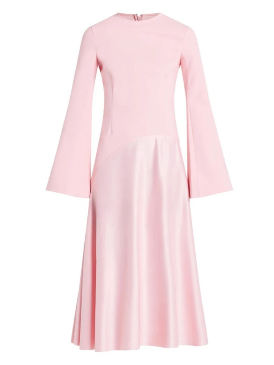 Pink dress with long sleeves on a white background