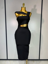 Black dress on a mannequin against a white background