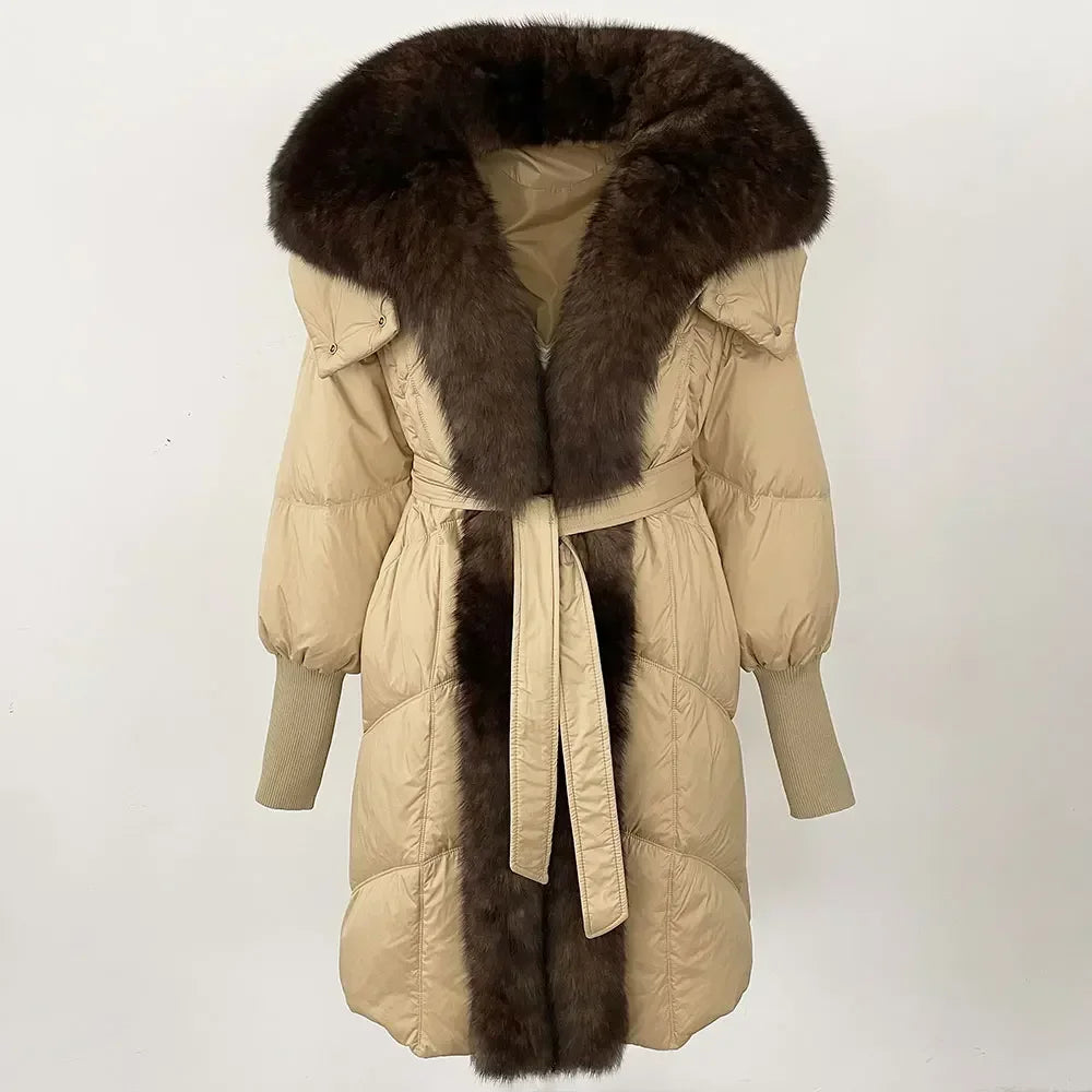 Beige winter coat with fur collar and fur trim on a white background