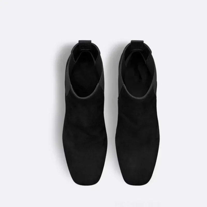 Top view of black suede ankle boots