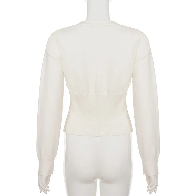 White long-sleeve top on a mannequin against a white background