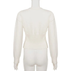 White long-sleeve top on a mannequin against a white background