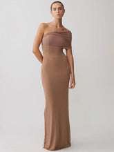 Woman wearing a brown strapless gown on a white background