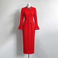 Red formal evening dress with crystal embellished neckline and flared sleeves on mannequin
