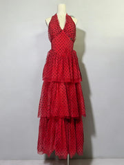 Red polka dot dress on a mannequin against a white background