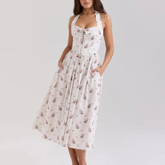 White floral dress on a model against a plain background