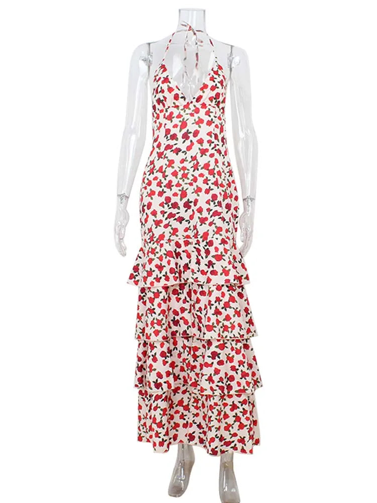 Red and white floral dress on a mannequin against a white background