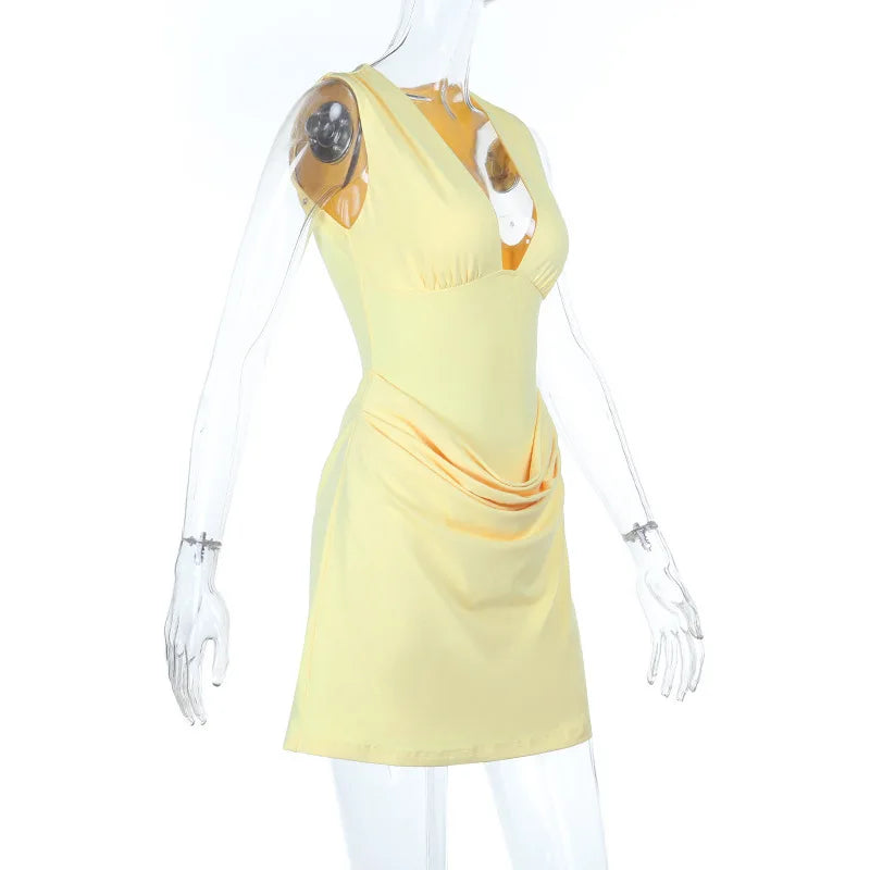 Mannequin wearing a yellow dress on a white background