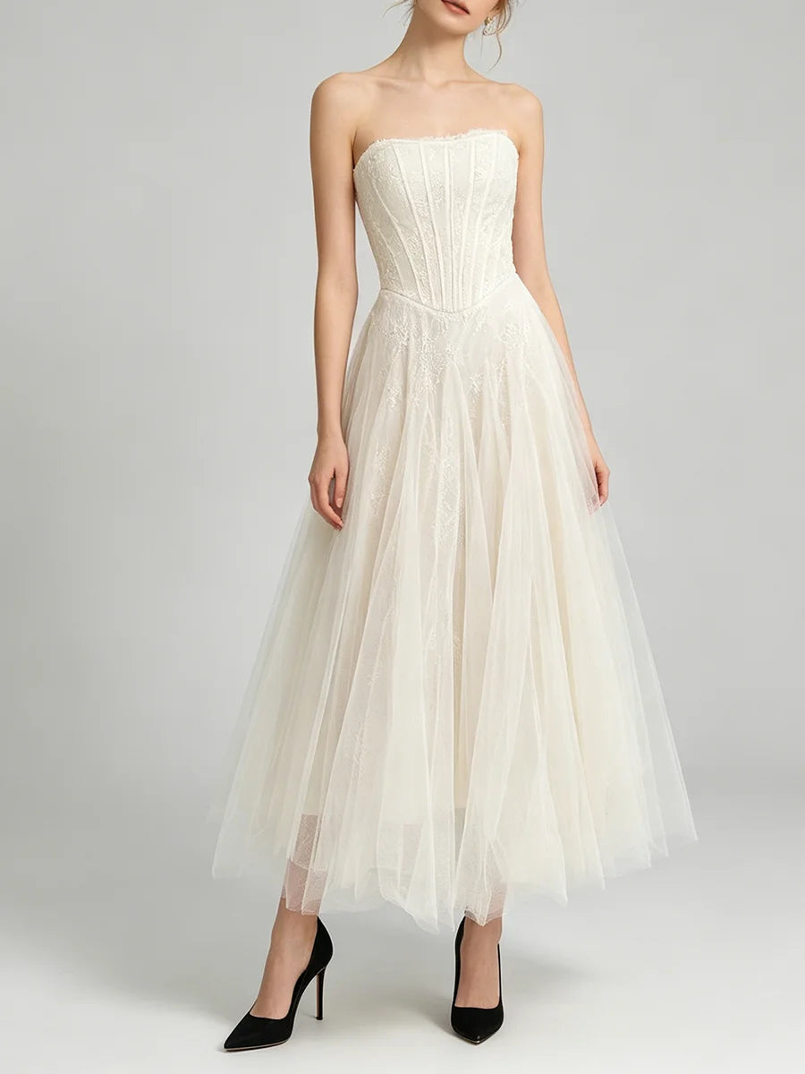 White lace corset midi dress with black heels