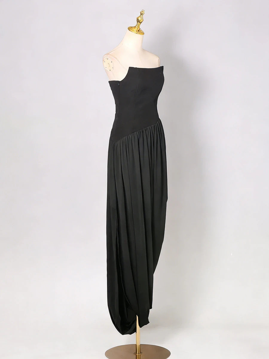 Black one-shoulder dress on a mannequin against a white background