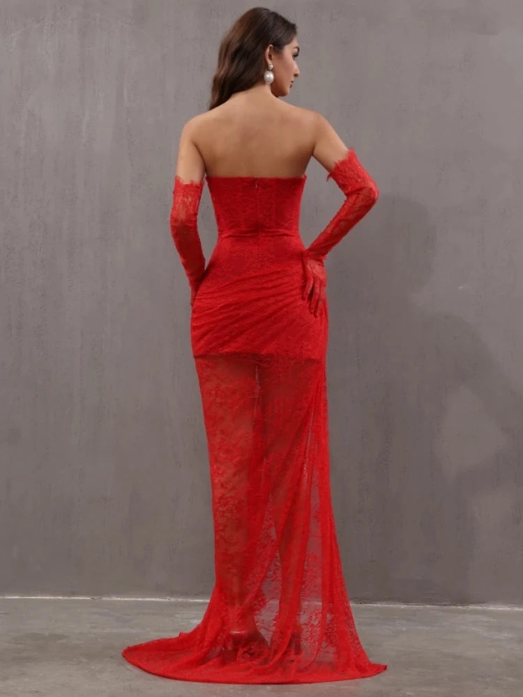 Red evening gown with sheer overlay and long gloves on a plain background