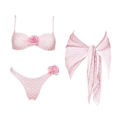 Pink polka dot bikini set with floral accents and matching scarf.