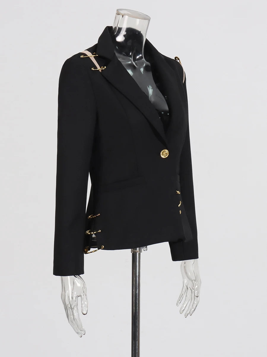 Black blazer with gold buttons on a mannequin against a white background