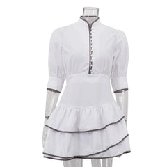 White dress with black trim on a mannequin against a white background