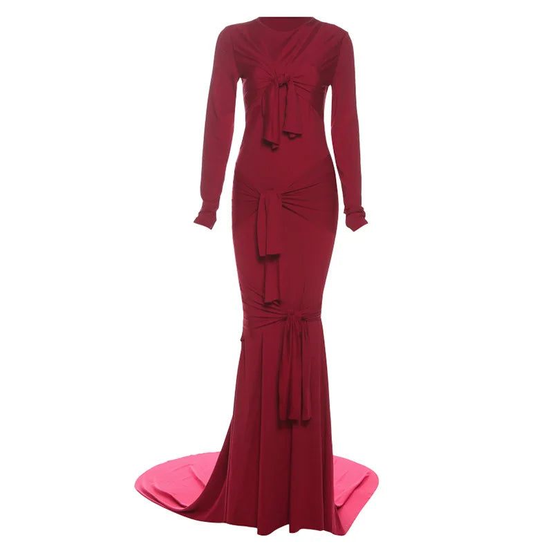 Red evening gown with long sleeves and a bow detail