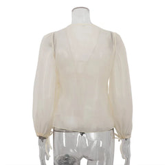 White blouse on a mannequin against a white background