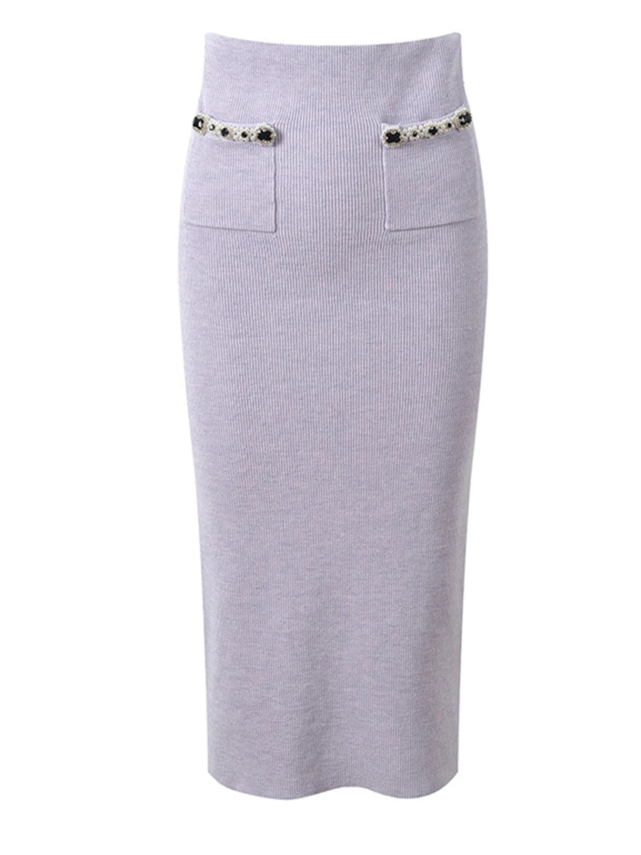 Light purple ribbed skirt with decorative buttons on a white background