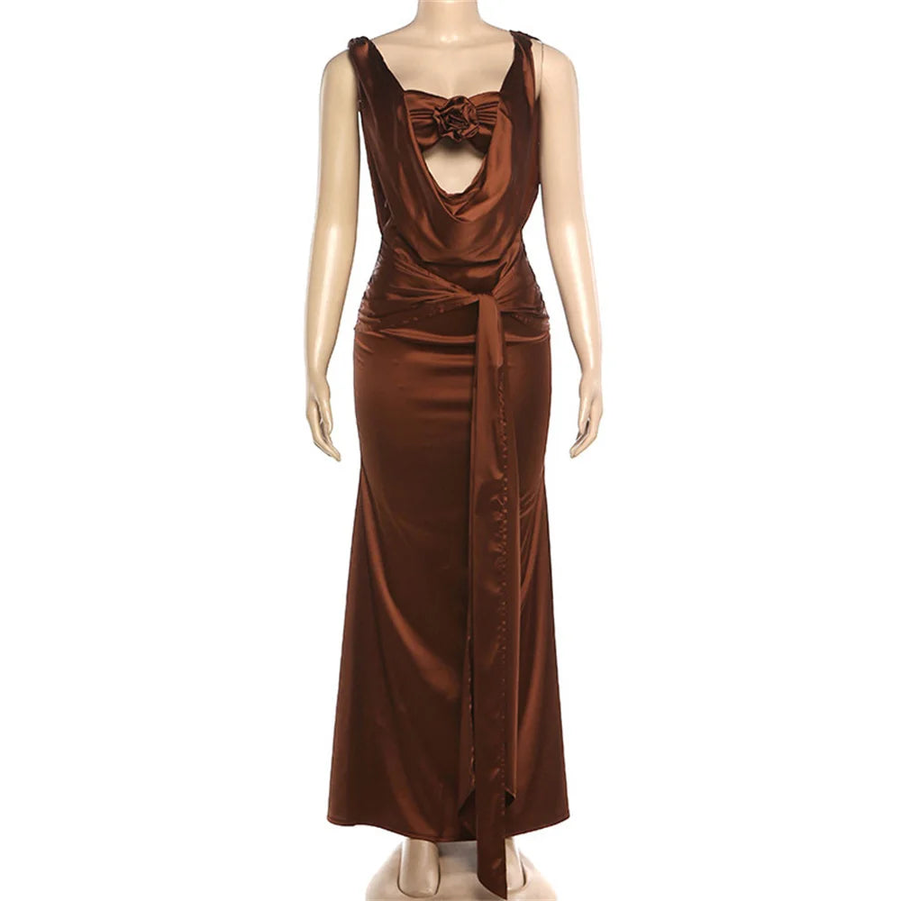 Brown evening gown on a mannequin against a white background