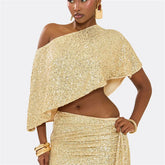 Woman wearing a gold sequin outfit on a light gray background
