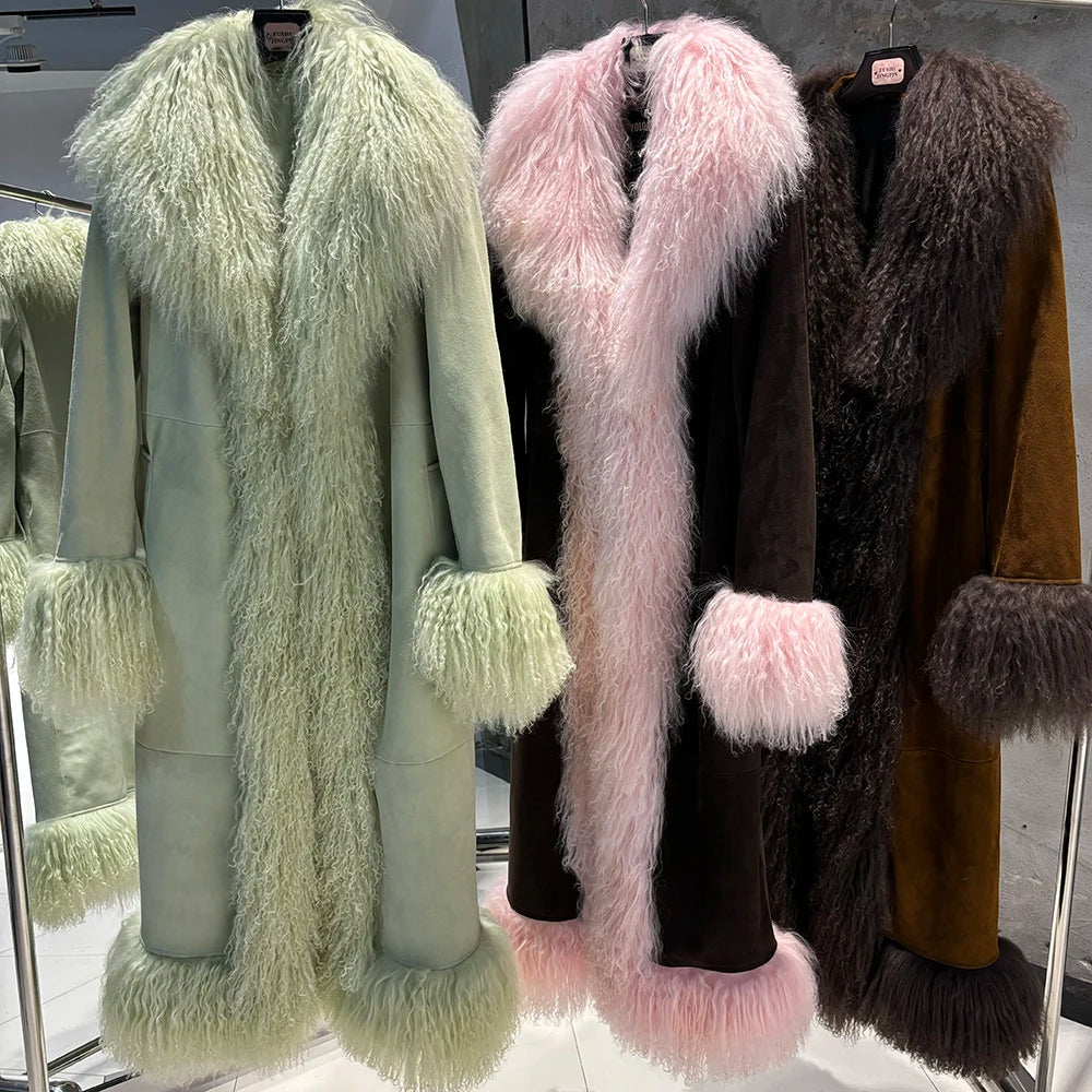 Three fur coats in green, pink, and brown displayed on hangers.