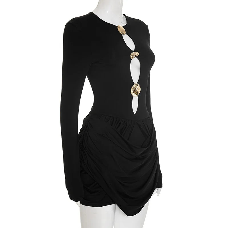 Black dress with gold embellishments on a mannequin against a white background