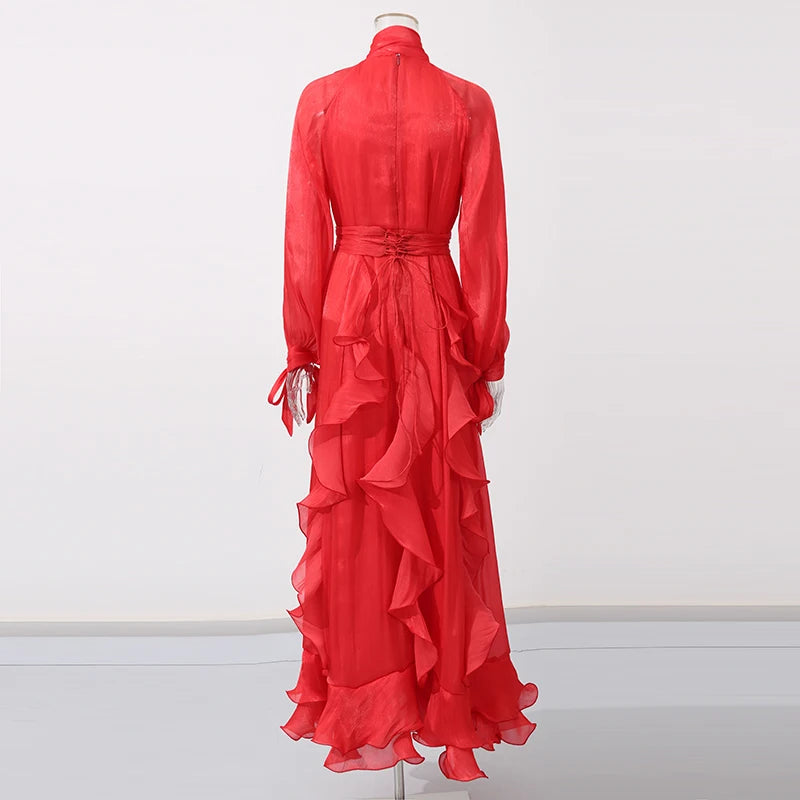 Red dress with ruffled layers on a white background