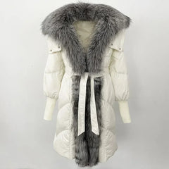 White winter coat with a long gray fur trim on a white background