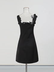 Black dress on a mannequin against a white background
