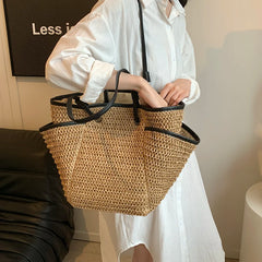 Person holding a woven basket with a plain background