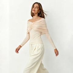 Off-shoulder pleated mesh top in motion