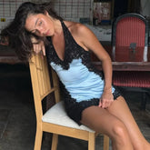 Lace paneled halter mini dress on chair