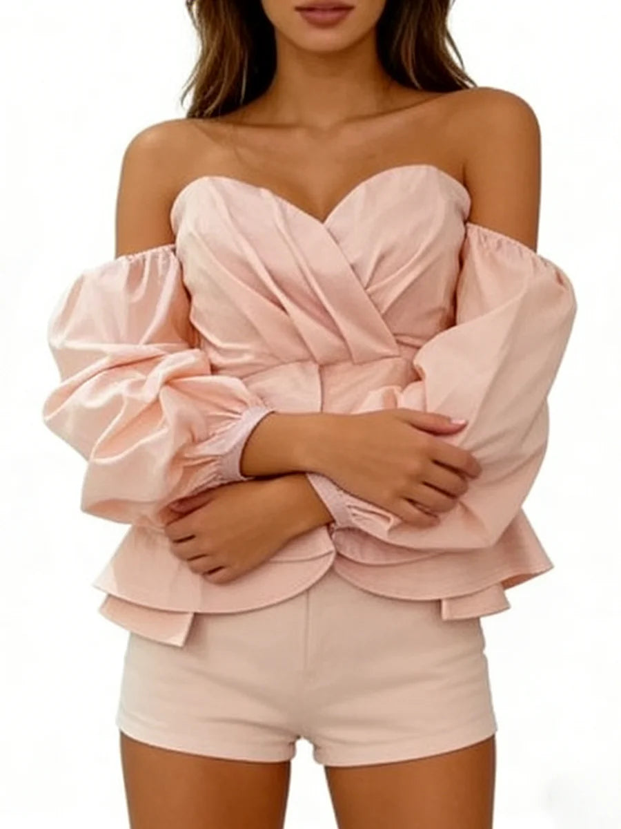 Pink off-shoulder top and shorts set on a white background