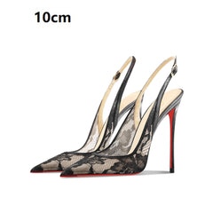 Black lace high-heeled shoes with a red sole on a white background