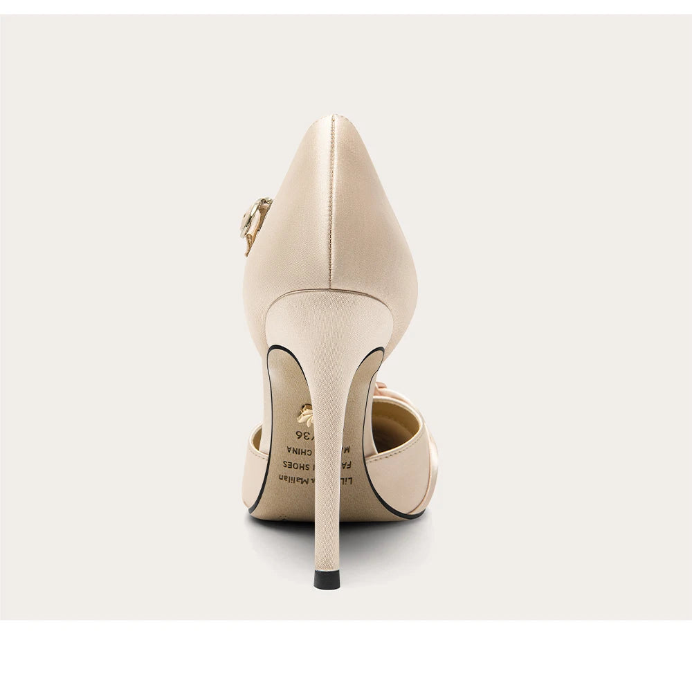 Beige high-heeled shoes on a white background