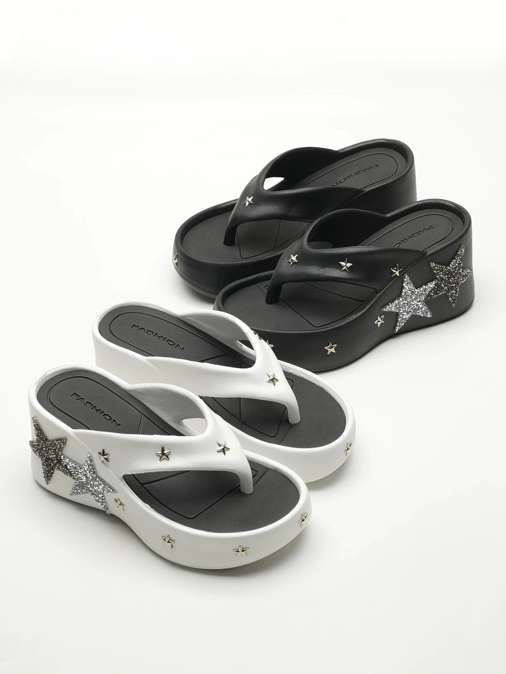 White and black platform wedge heels displayed together