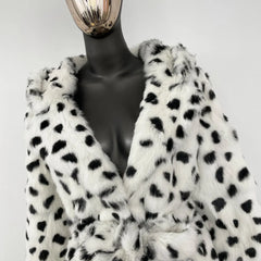 Mannequin wearing a white fur coat with black spots on a white background