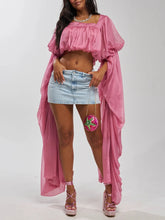 Pink draped square neck crop top with long flowing sleeves and a mini denim skirt.